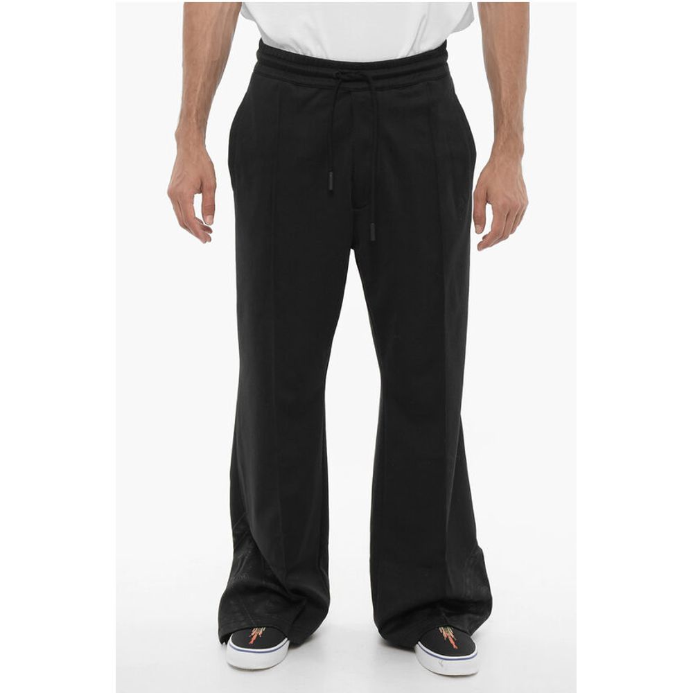 Широкие спортивные брюки с завязкой на талии Marcelo Burlon, Black
Широкие спортивные брюки с завязкой на талии Marcelo Burlon, Black