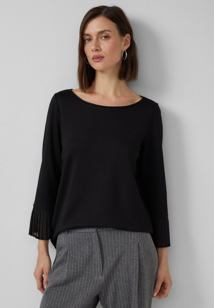 Топ s.Oliver Long sleeved top, Schwarz/Black
Топ s.Oliver Long sleeved top, Schwarz/Black