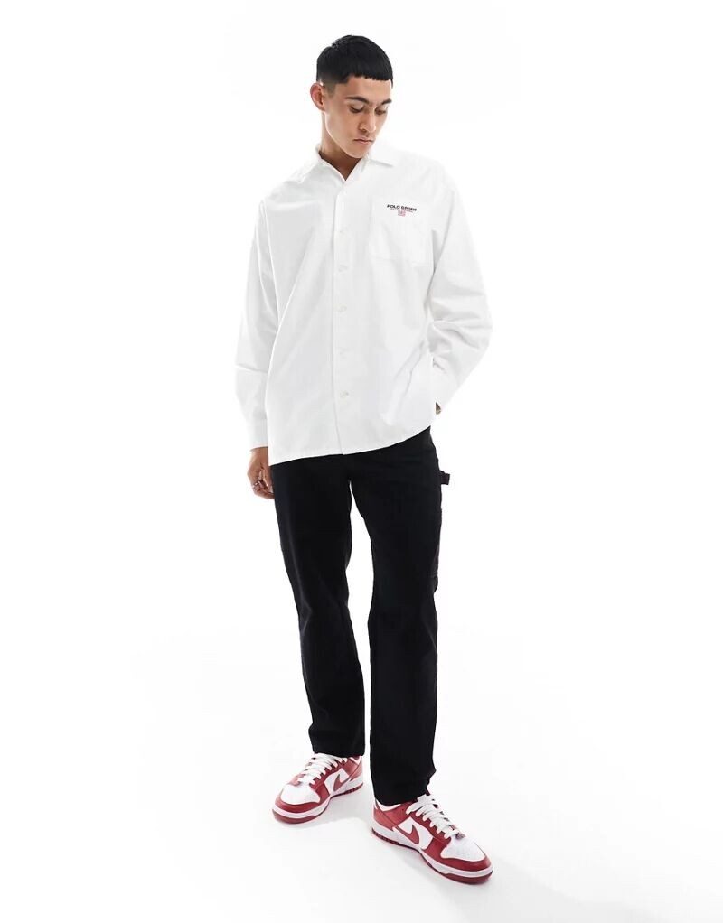 Белая рубашка чинос оверсайз с логотипом на нагрудном кармане Polo Ralph Lauren Sport Capsule
Белая рубашка чинос оверсайз с логотипом на нагрудном кармане Polo Ralph Lauren Sport Capsule