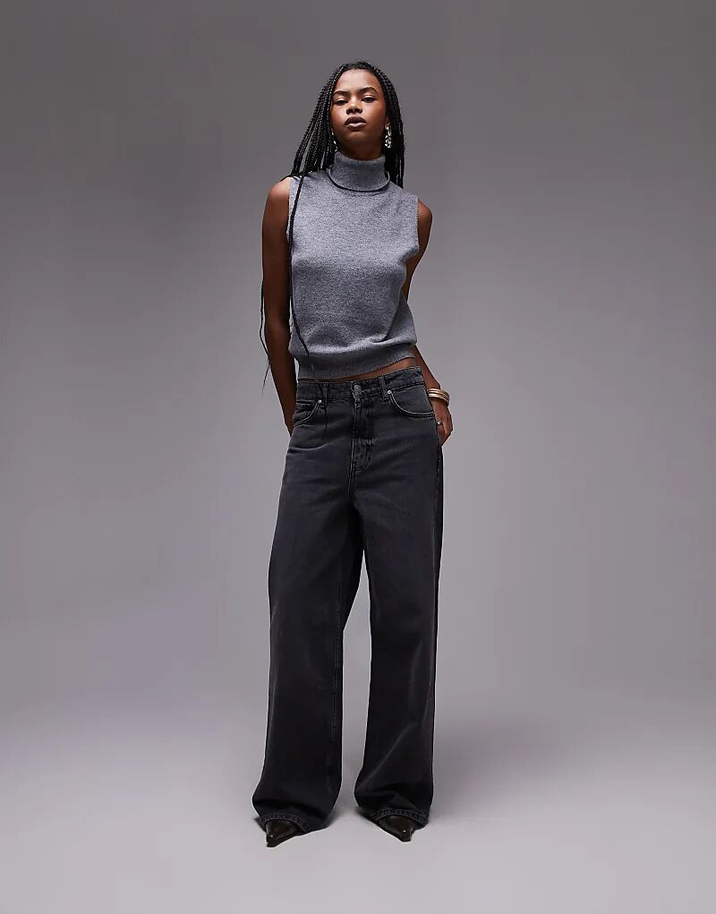 Длинные прямые джинсы черного цвета с потертостями Mango
Длинные прямые джинсы черного цвета с потертостями Mango