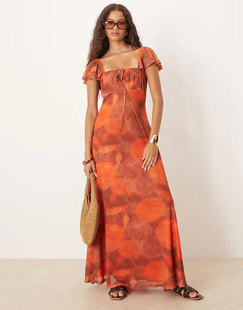 Платье макси с открытой спиной ASOS DESIGN из сетчатой ткани с оранжевым принтом
Платье макси с открытой спиной ASOS DESIGN из сетчатой ткани с оранжевым принтом