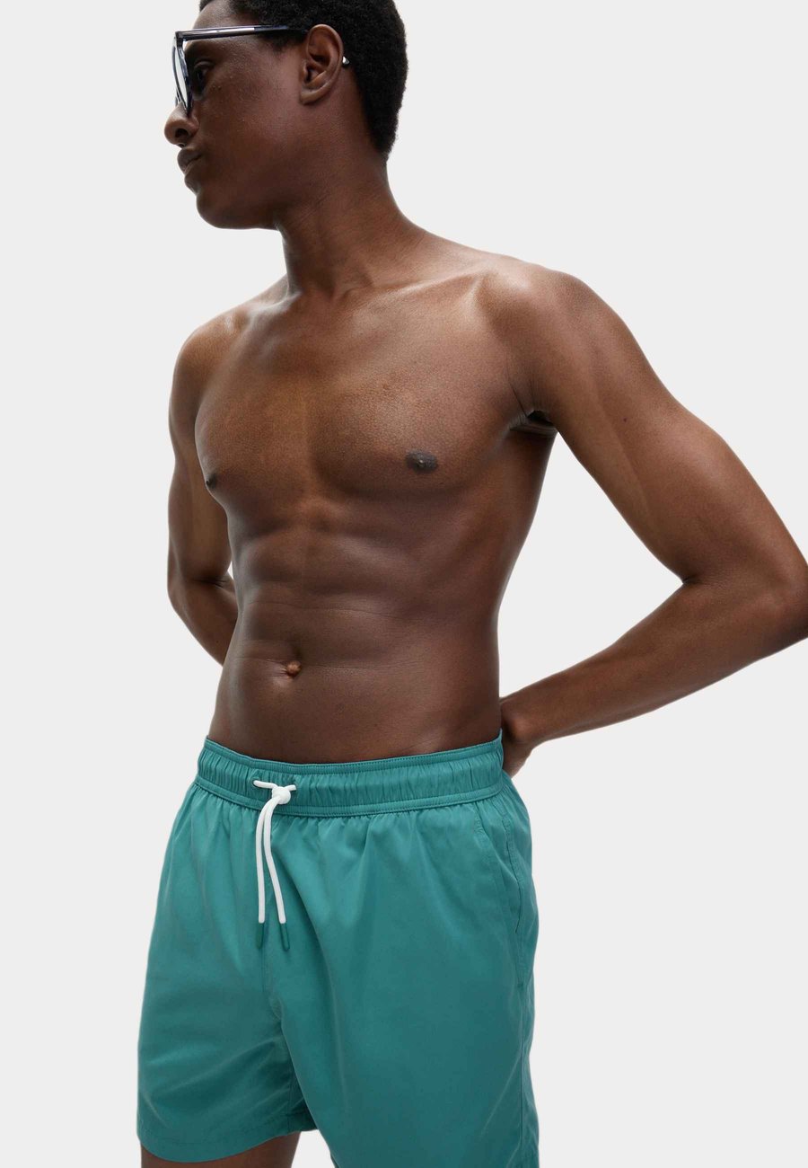 Шорты для плавания Marks & Spencer Swimming shorts, Teal Green/Mottled Dark Green
Шорты для плавания Marks & Spencer Swimming shorts, Teal Green/Mottled Dark Green