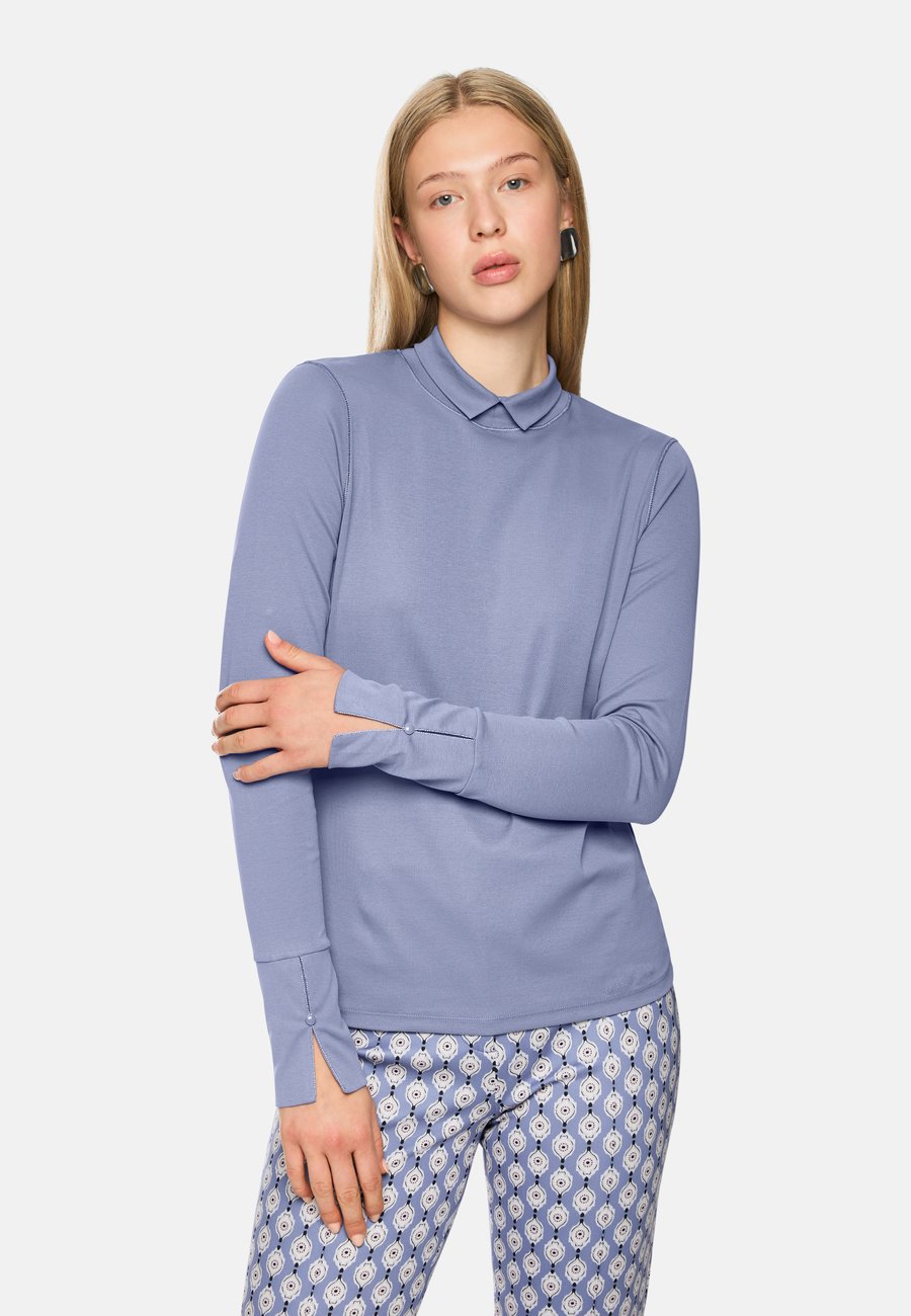 Топ Marc Cain Long sleeved top, Bluish Violet/Blue
Топ Marc Cain Long sleeved top, Bluish Violet/Blue