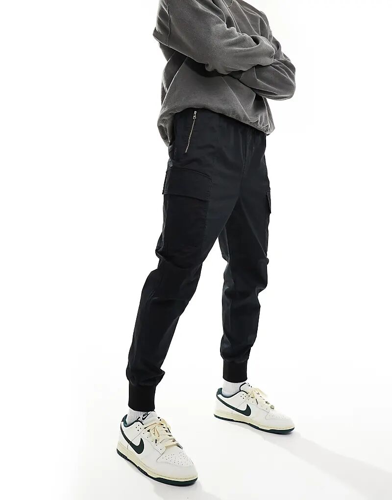 Потертые брюки-карго черного цвета Hera
Потертые брюки-карго черного цвета Hera