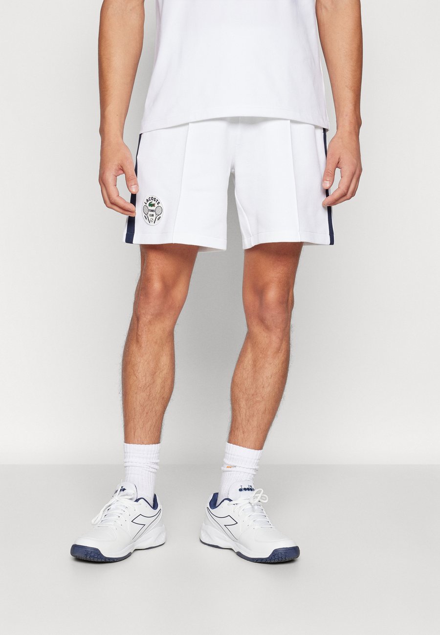 Спортивные шорты Lacoste Sport SHORT HERITAGE, White/Navy Blue/White
Спортивные шорты Lacoste Sport SHORT HERITAGE, White/Navy Blue/White