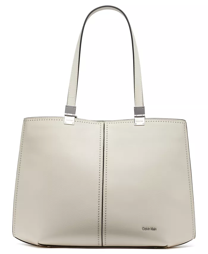 Гранитовая сумка-тоут с тремя отделениями и шипами Calvin Klein, белый
Гранитовая сумка-тоут с тремя отделениями и шипами Calvin Klein, белый