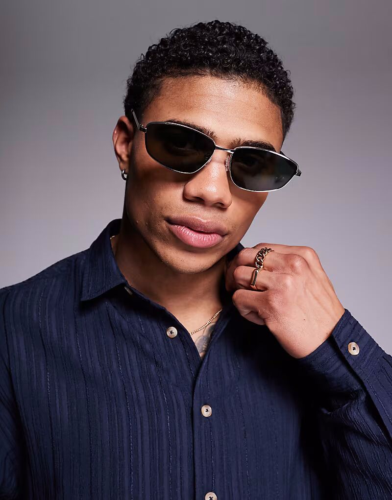 Солнцезащитные очки без оправы ASOS DESIGN Festival со скошенными краями, зелеными тонированными линзами и серебристой металлической оправой
Солнцезащитные очки без оправы ASOS DESIGN Festival со скошенными краями, зелеными тонированными линзами и серебристой металлической оправой