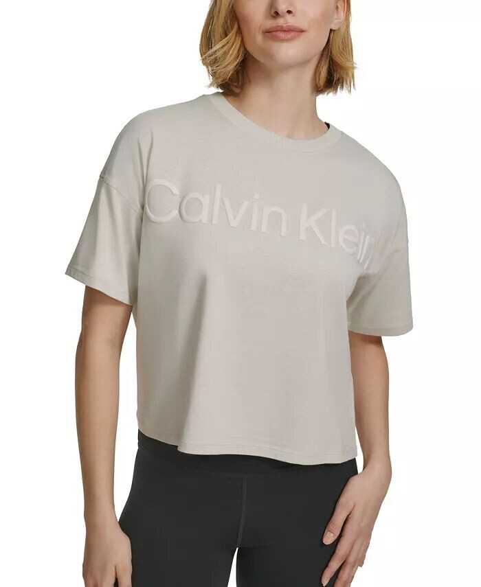Женская хлопковая укороченная футболка с рельефным логотипом Calvin Klein, бежевый
Женская хлопковая укороченная футболка с рельефным логотипом Calvin Klein, бежевый