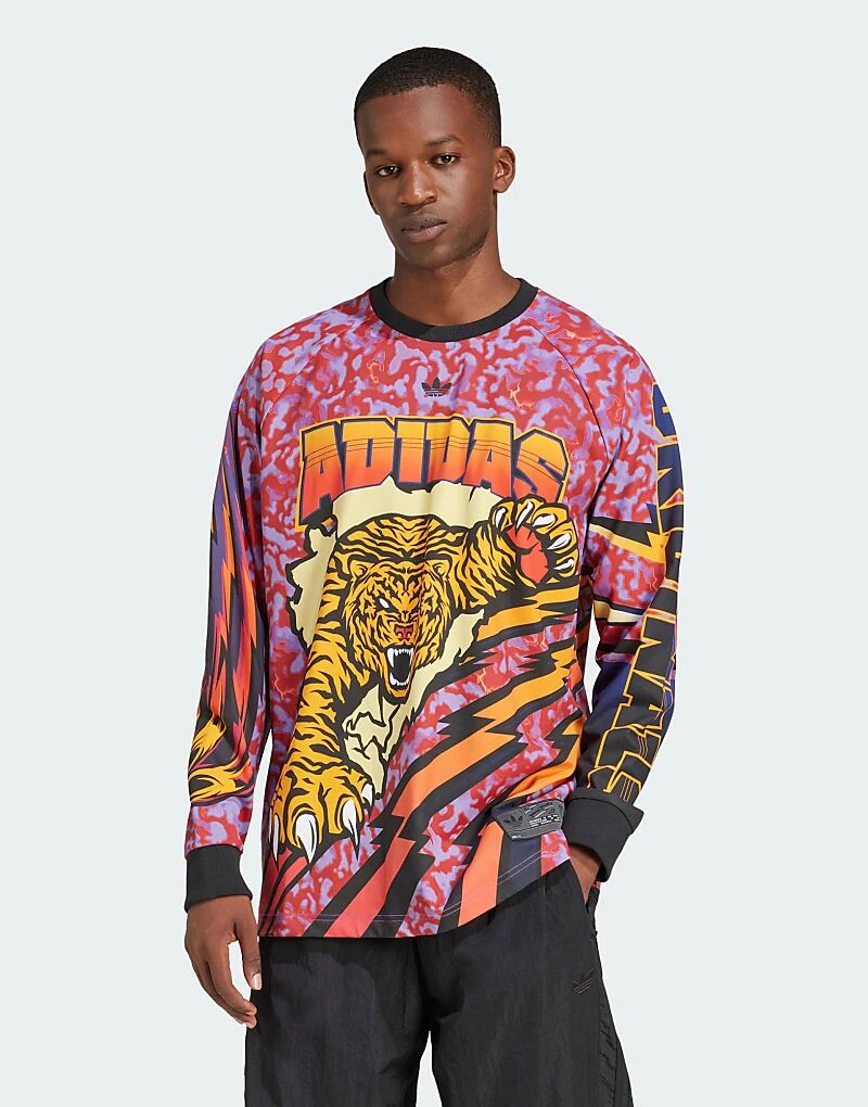 Футболка с длинными рукавами и принтом Adilenium Season 3 красного цвета adidas Originals
Футболка с длинными рукавами и принтом Adilenium Season 3 красного цвета adidas Originals
