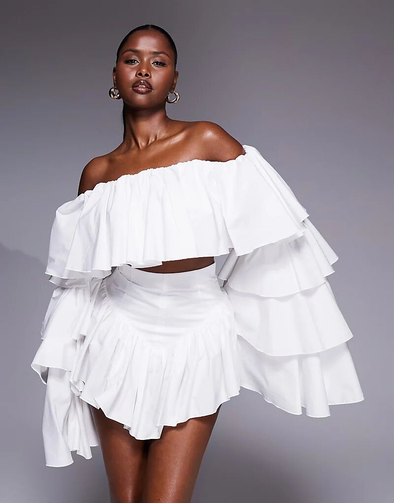 Белый топ-комбинезон с оборками от The Dolls House Circa Madonna
Белый топ-комбинезон с оборками от The Dolls House Circa Madonna