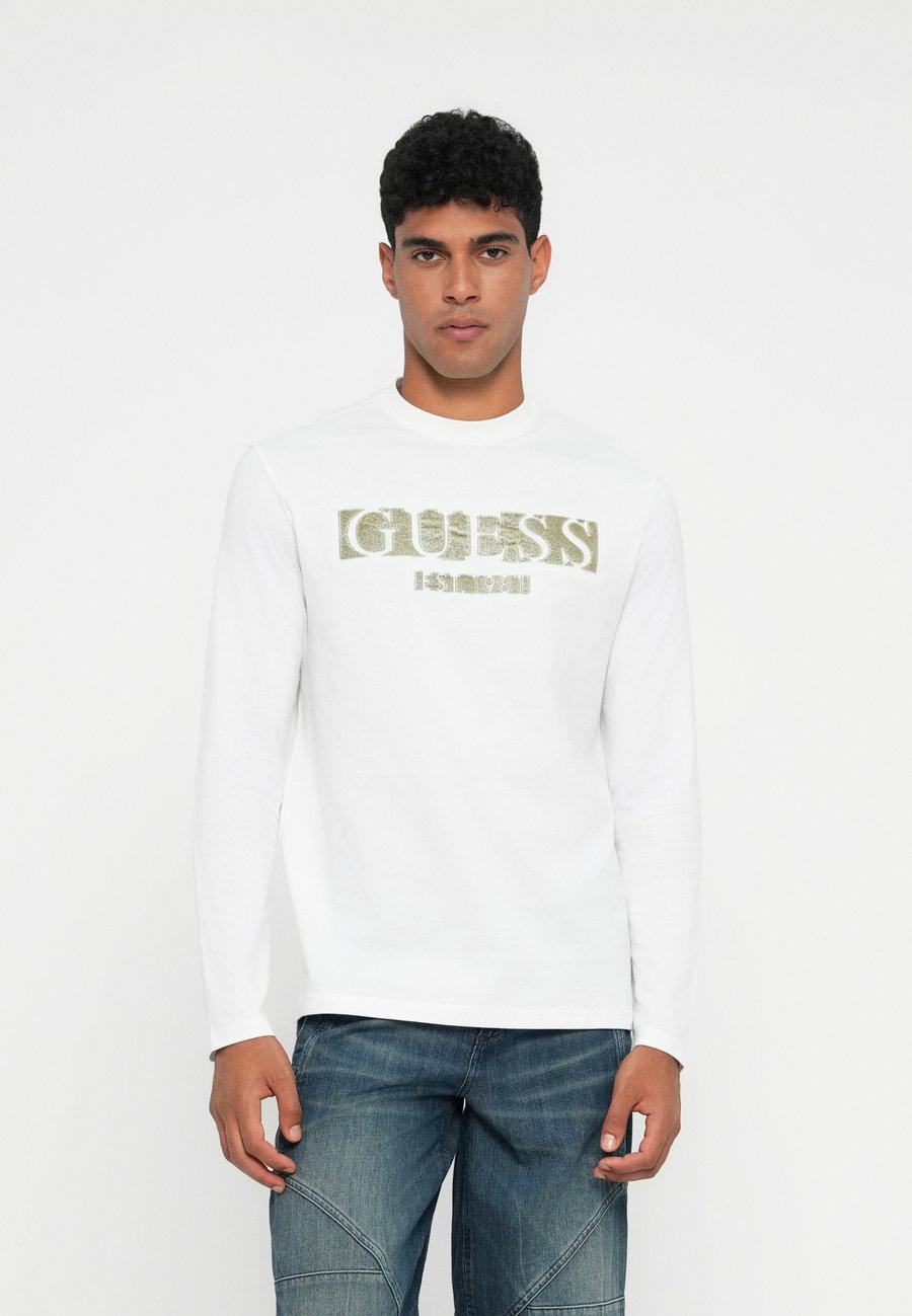 Топ Guess LOGO FLOCK TEE, Pure White/White
Топ Guess LOGO FLOCK TEE, Pure White/White