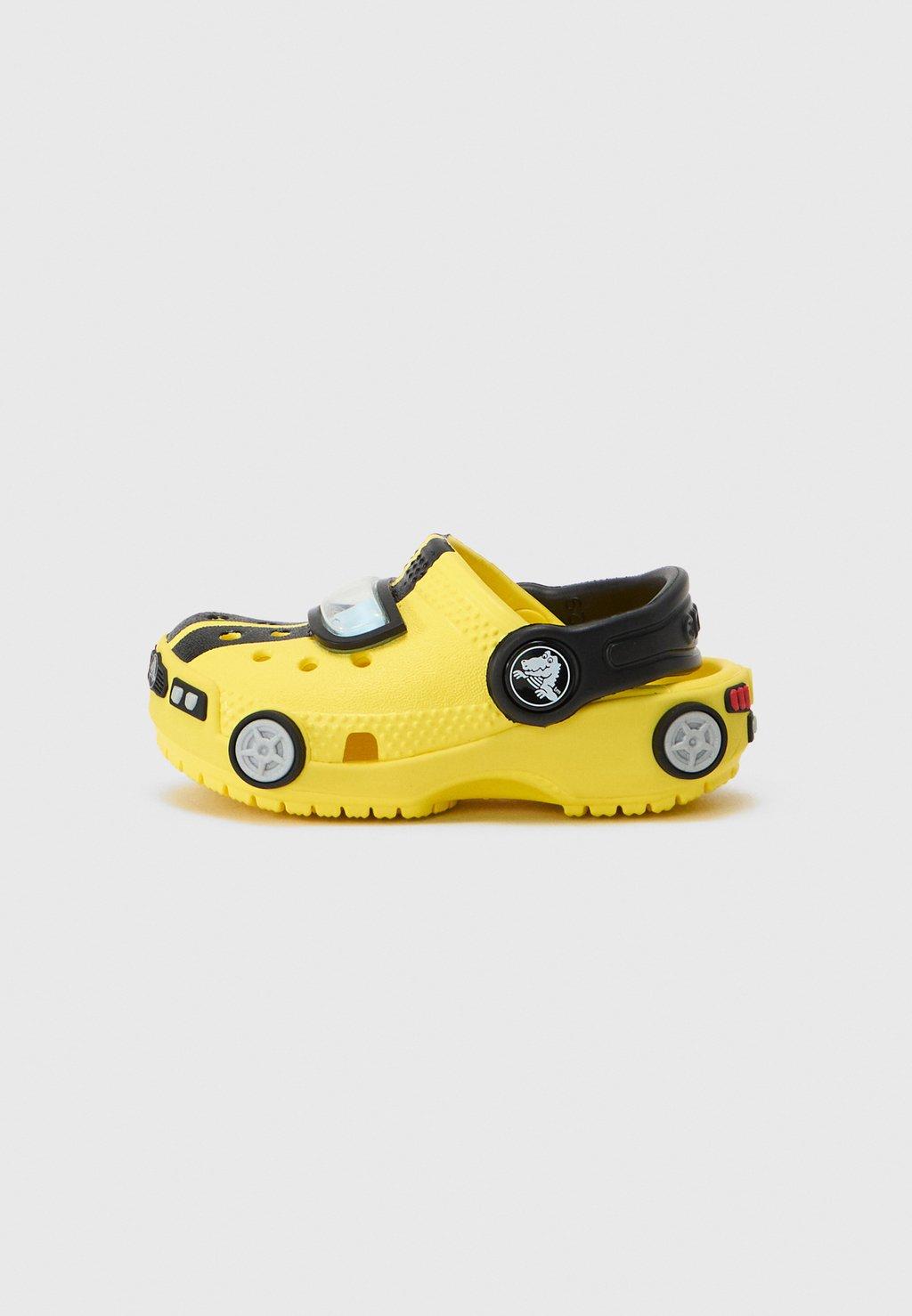 Тапочки RACE CAR UNISEX - Clogs Crocs, желтый
Тапочки RACE CAR UNISEX - Clogs Crocs, желтый
