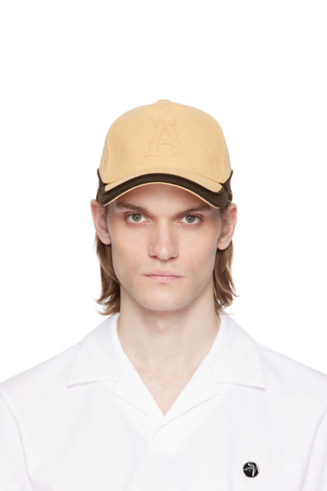 Кепка с нашивкой «А» из бежевого и черного холста AMBUSH
Кепка с нашивкой «А» из бежевого и черного холста AMBUSH