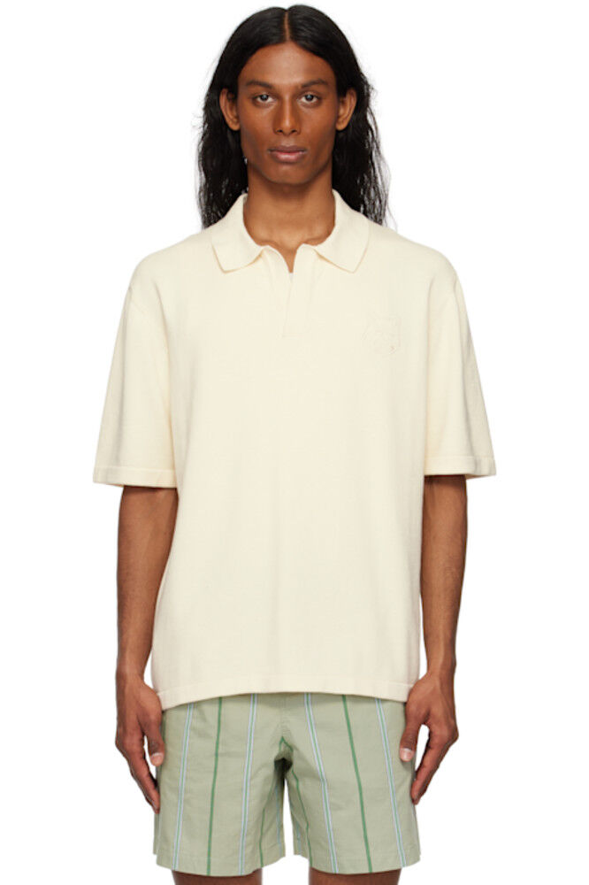 Вязаное поло с вышитой яркой лисьей головой от белого цвета Maison Kitsuné
Вязаное поло с вышитой яркой лисьей головой от белого цвета Maison Kitsuné