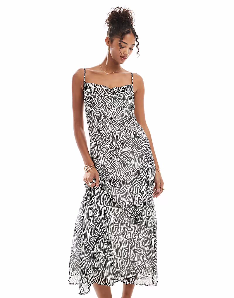Платье миди на бретелях с воротником-хомутом Vero Moda Smilla с зебровым принтом
Платье миди на бретелях с воротником-хомутом Vero Moda Smilla с зебровым принтом