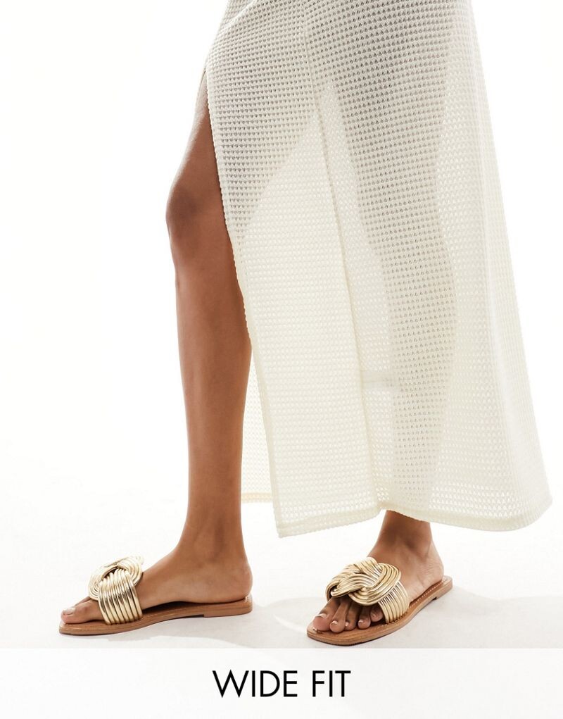 ASOS DESIGN Wide Fit – Fifi – плетеные сандалии на плоской подошве золотого цвета
ASOS DESIGN Wide Fit – Fifi – плетеные сандалии на плоской подошве золотого цвета