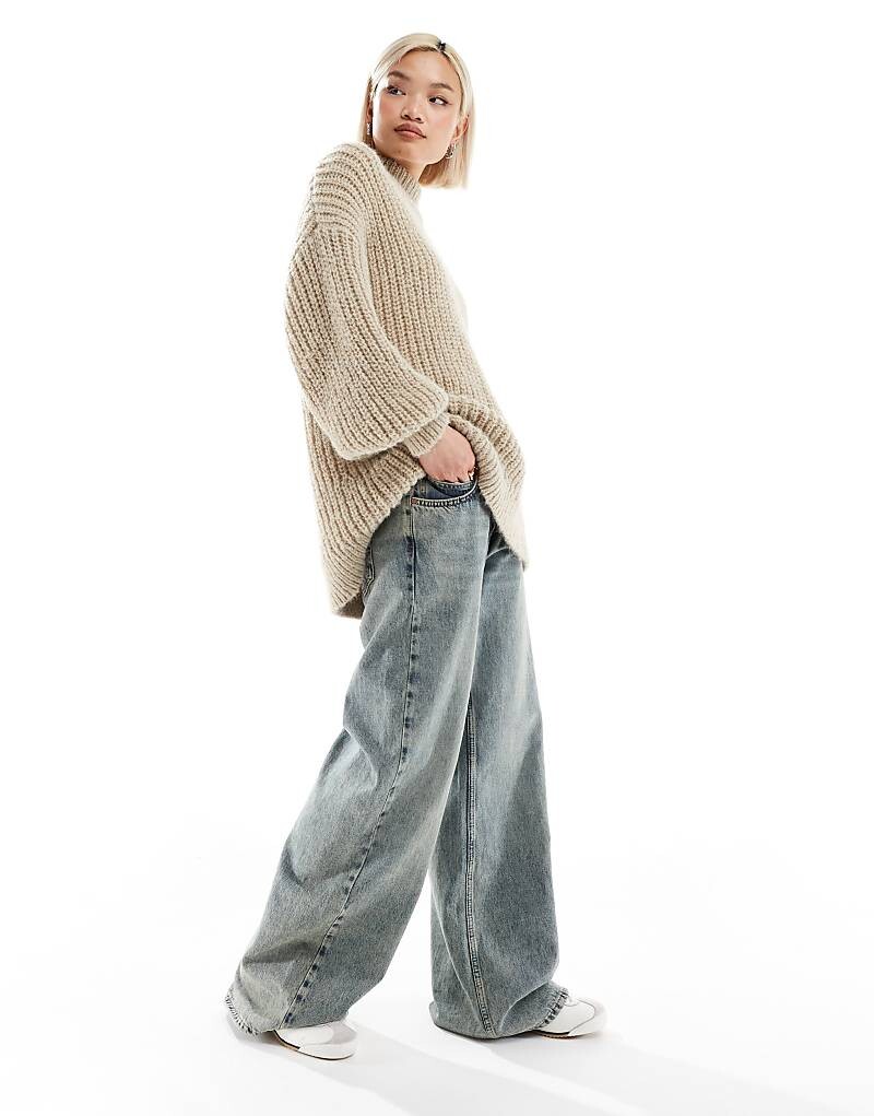 Бежевый джемпер крупной вязки в рубчик с высоким воротником и объемными рукавами Monki
Бежевый джемпер крупной вязки в рубчик с высоким воротником и объемными рукавами Monki