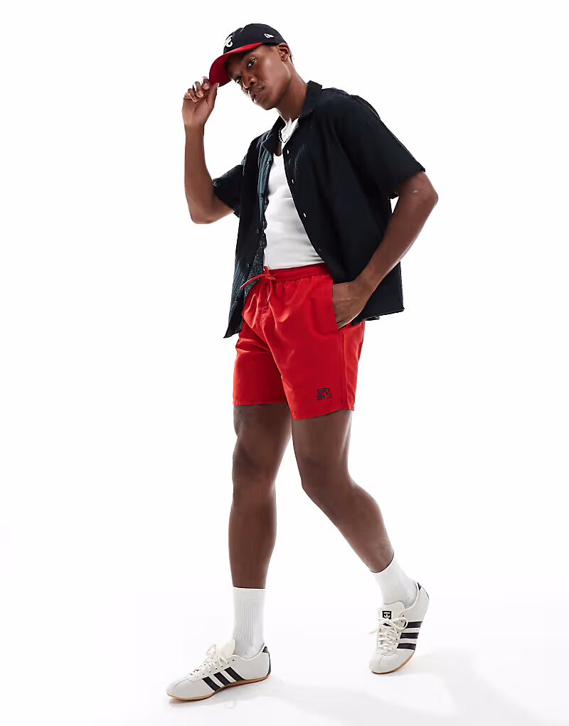 Плавки-шорты Superdry Essential длиной 17 дюймов в ярко-красном цвете
Плавки-шорты Superdry Essential длиной 17 дюймов в ярко-красном цвете