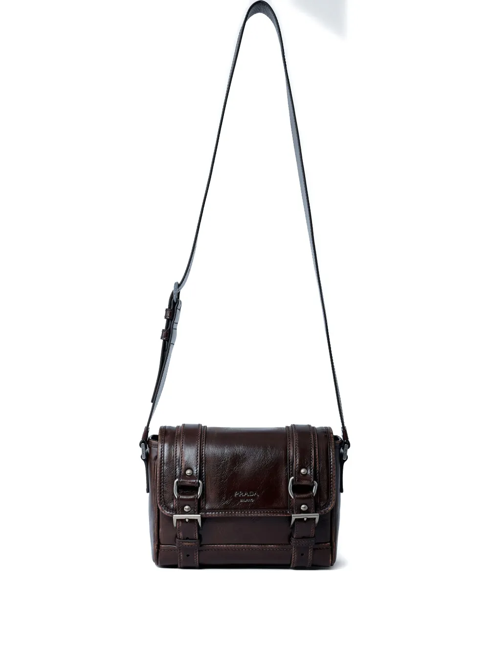 Исследуйте кожаную кросс-боди сумку с пряжкой Prada, коричневый
Исследуйте кожаную кросс-боди сумку с пряжкой Prada, коричневый