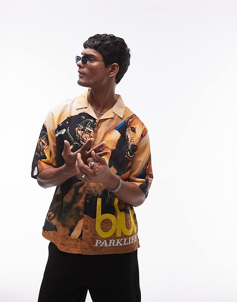Topman – красочная рубашка с короткими рукавами и лицензированной обложкой альбома BLUR
Topman – красочная рубашка с короткими рукавами и лицензированной обложкой альбома BLUR