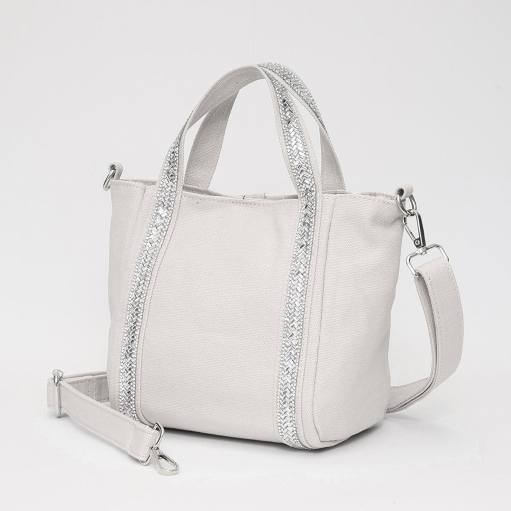 Мини-сумка-шоппер из холста с ремешком, украшенным стразами, и возможностью ношения через плечо FASHNZFAB, слоновая кость 
Мини-сумка-шоппер из холста с ремешком, украшенным стразами, и возможностью ношения через плечо FASHNZFAB, слоновая кость