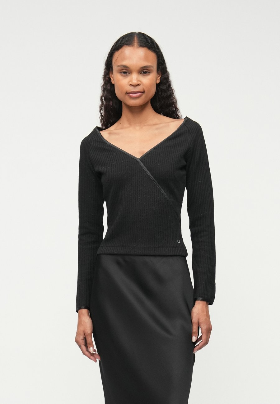 Топ Guess MATILDE CROSS V NECK, Jet Black/Black
Топ Guess MATILDE CROSS V NECK, Jet Black/Black