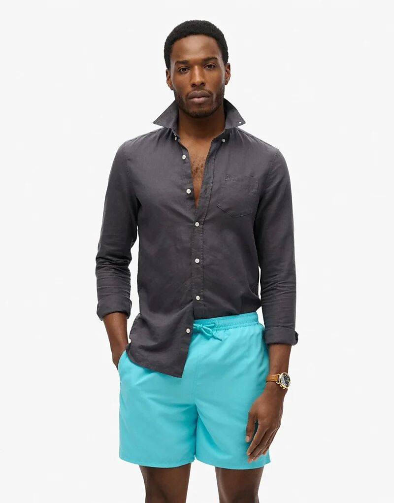 Плавки-шорты Superdry Essential длиной 17 дюймов в цвете аквамарин
Плавки-шорты Superdry Essential длиной 17 дюймов в цвете аквамарин