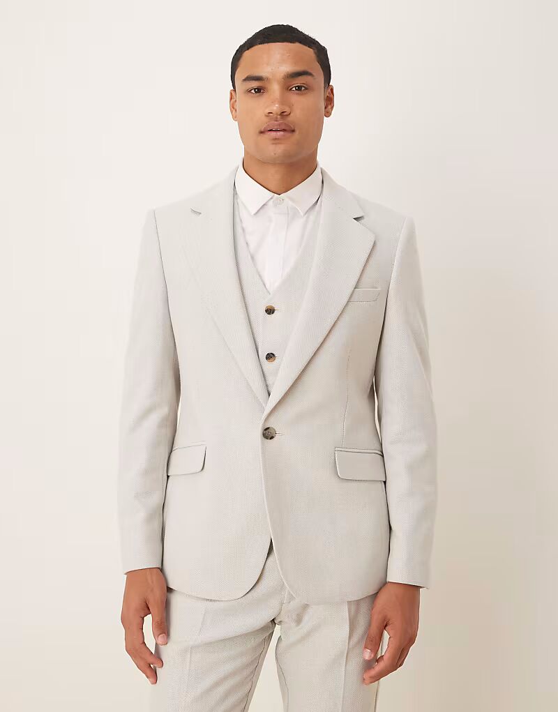 Узкий пиджак из шерстяной смеси светло-серого цвета с узором «ёлочка» Asos Design
Узкий пиджак из шерстяной смеси светло-серого цвета с узором «ёлочка» Asos Design