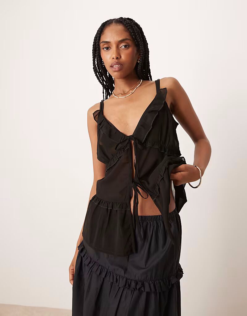 Эксклюзивный пляжный топ из сетки с завязками спереди черного цвета от Esmee Esmée
Эксклюзивный пляжный топ из сетки с завязками спереди черного цвета от Esmee Esmée