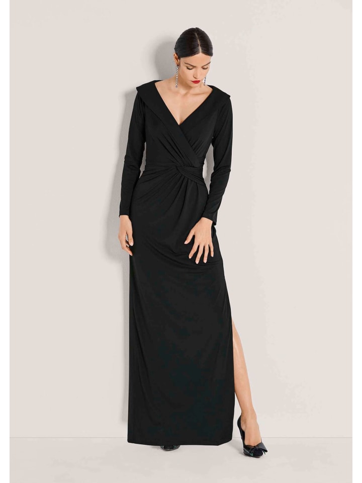 MADELEINE Элегантное эластичное платье с запахом, черного цвета
MADELEINE Элегантное эластичное платье с запахом, черного цвета