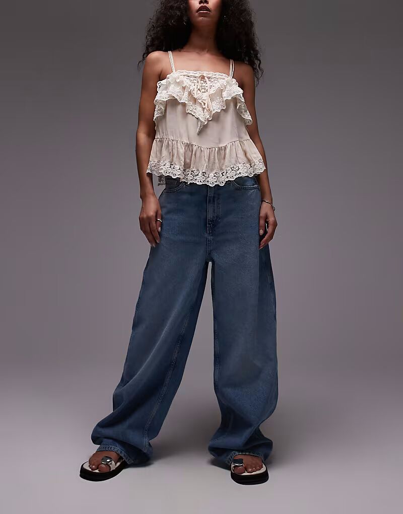 Свободные мешковатые джинсы Mango Camilla синего цвета с потертостями спереди
Свободные мешковатые джинсы Mango Camilla синего цвета с потертостями спереди