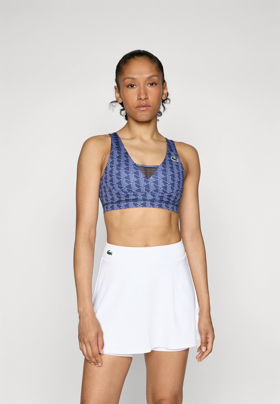 Бюстгальтер Lacoste Sport BRA ACTIVE, Navy Blue/Delphinium/Dark Blue
Бюстгальтер Lacoste Sport BRA ACTIVE, Navy Blue/Delphinium/Dark Blue