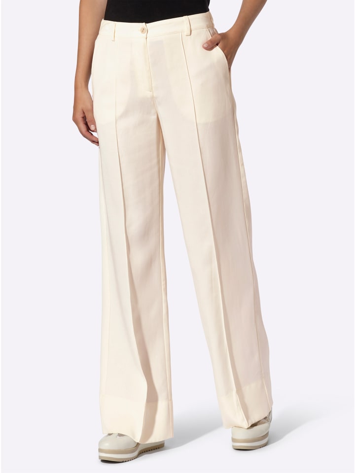 Брюки цвета шампанского Heine
Брюки цвета шампанского Heine