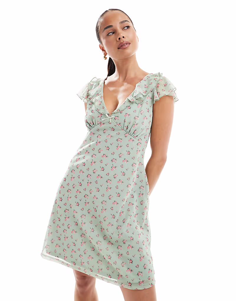 Мини-платье New Look с оборкой на горловине и зеленым цветочным принтом
Мини-платье New Look с оборкой на горловине и зеленым цветочным принтом