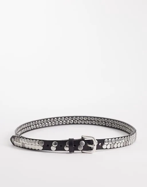 Черный узкий ремень с заклепками и декором Mango
Черный узкий ремень с заклепками и декором Mango