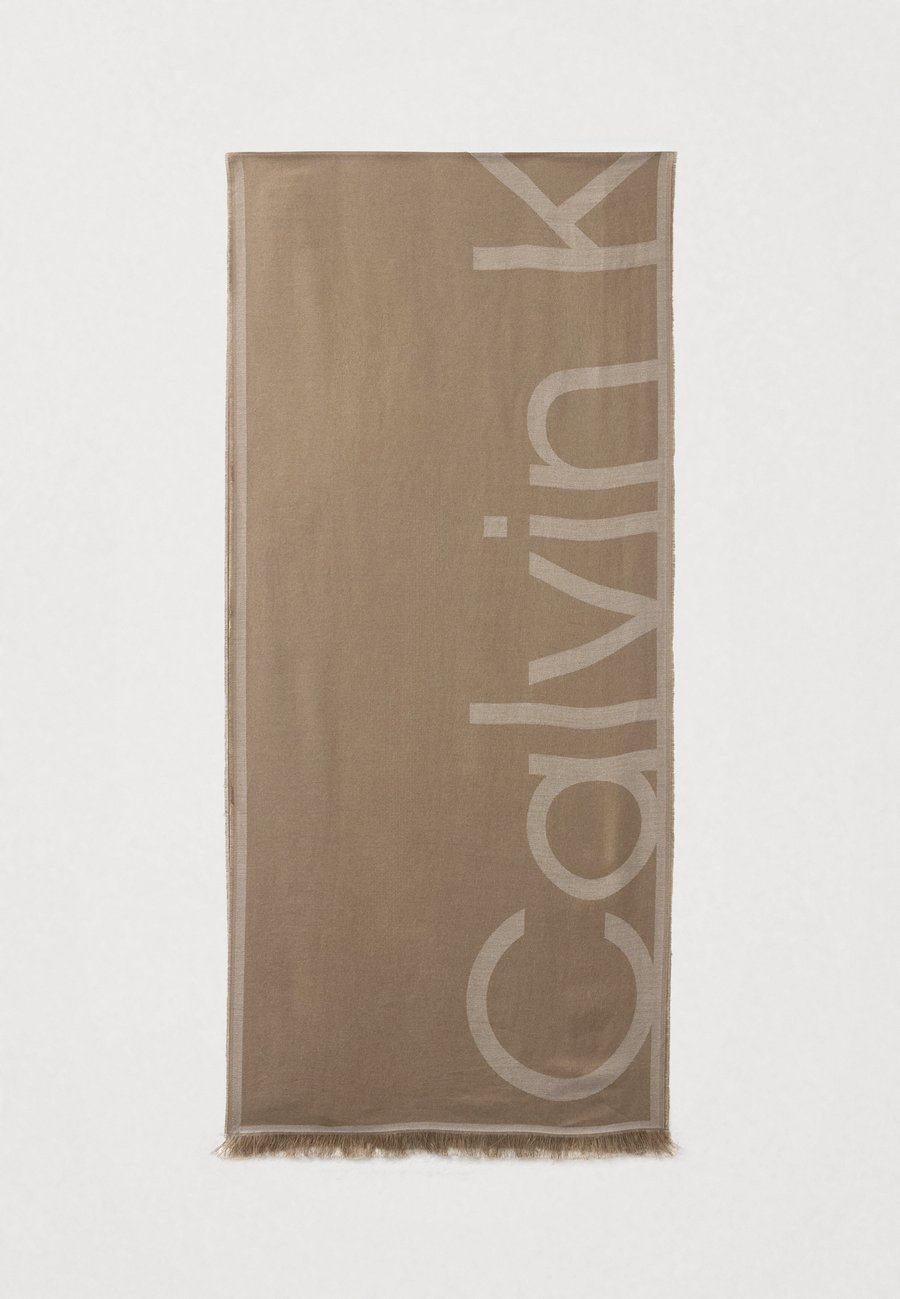 Шарф Calvin Klein OVERSIZED LOGO STOLE UNISEX, Desert Taupe/Nacreous Clouds/Taupe
Шарф Calvin Klein OVERSIZED LOGO STOLE UNISEX, Desert Taupe/Nacreous Clouds/Taupe