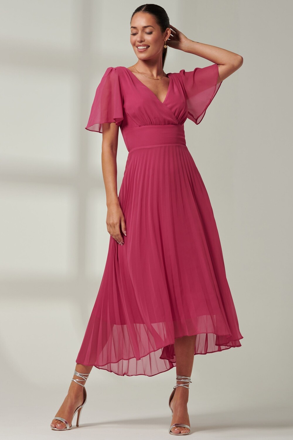 Плиссированное платье макси Elene из шифона с асимметричным подолом Jolie Moi, розовый 
Плиссированное платье макси Elene из шифона с асимметричным подолом Jolie Moi, розовый