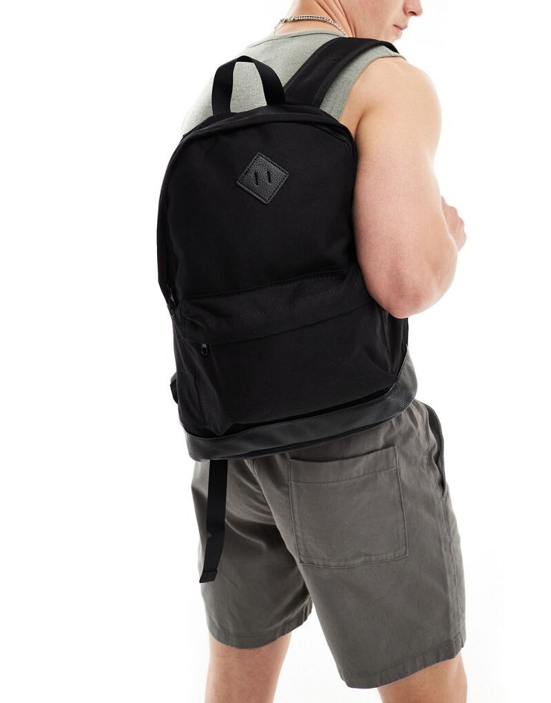 Черный холщовый рюкзак на основе из искусственной кожи ASOS DESIGN
Черный холщовый рюкзак на основе из искусственной кожи ASOS DESIGN