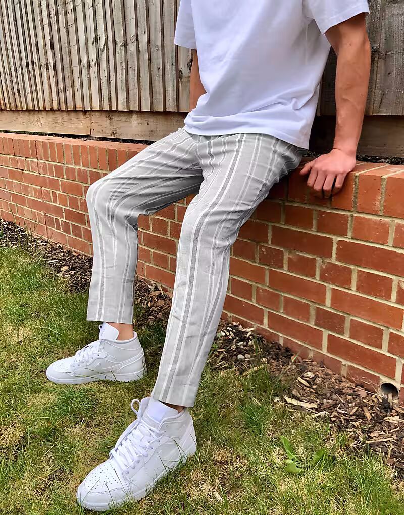 Зауженные элегантные брюки из серого льна в полоску Asos Design
Зауженные элегантные брюки из серого льна в полоску Asos Design