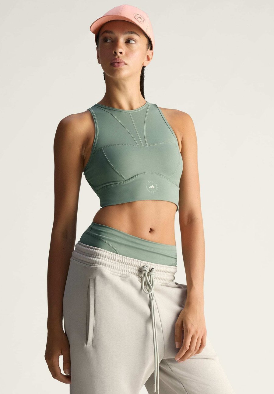 Бюстгальтер Adidas by Stella McCartney TRAINING CROP, Stone Green/Green
Бюстгальтер Adidas by Stella McCartney TRAINING CROP, Stone Green/Green
