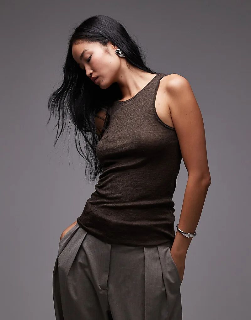 Уютный вязаный жилет ARKET из мериносовой шерсти коричневого цвета
Уютный вязаный жилет ARKET из мериносовой шерсти коричневого цвета