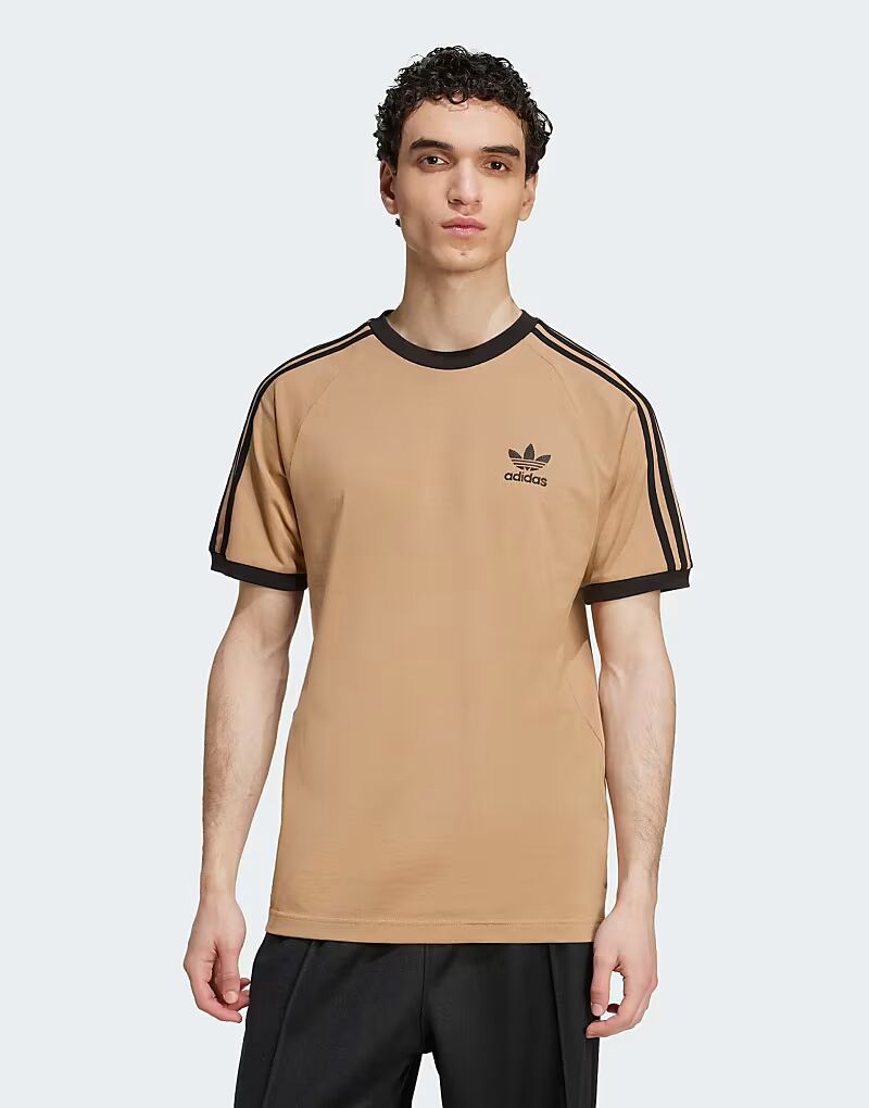 Футболка Adicolor classics с тремя полосками бежевого и черного цветов Adidas Originals
Футболка Adicolor classics с тремя полосками бежевого и черного цветов Adidas Originals