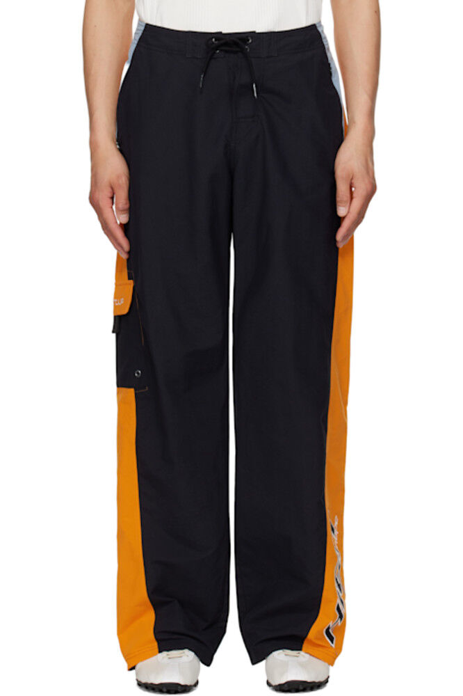 Черно-оранжевые шорты для бега Martine Rose
Черно-оранжевые шорты для бега Martine Rose