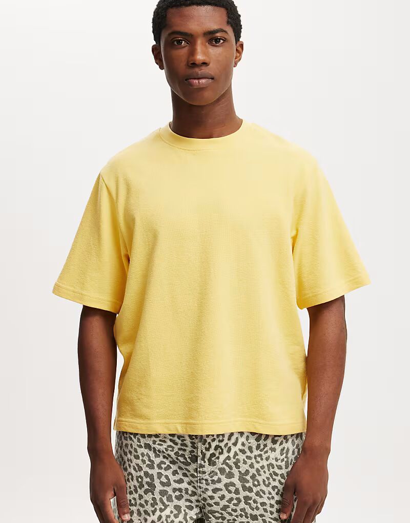 Футболка укороченного кроя из махровой ткани цвета солнечного желтого солнца Cotton:On
Футболка укороченного кроя из махровой ткани цвета солнечного желтого солнца Cotton:On