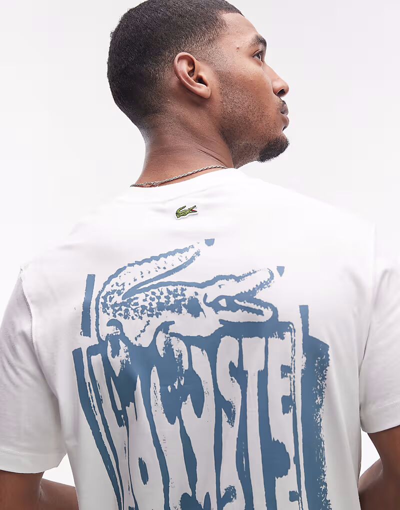 Футболка свободного кроя Lacoste белого цвета с графическим принтом на груди и спине
Футболка свободного кроя Lacoste белого цвета с графическим принтом на груди и спине