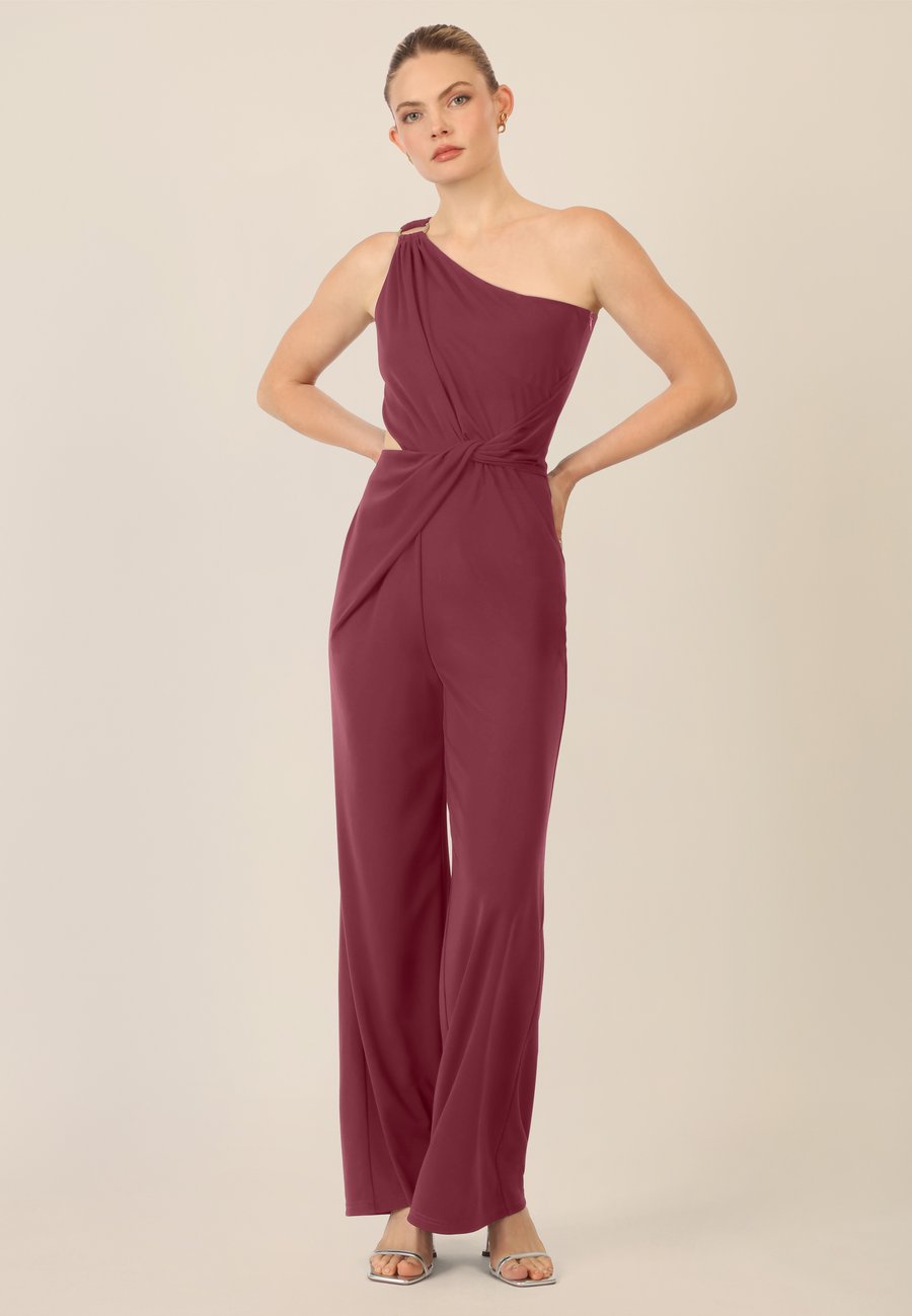 Комбинезон Apart ONE SHOULDER OVERALL, Bordeauxrot/Bordeaux
Комбинезон Apart ONE SHOULDER OVERALL, Bordeauxrot/Bordeaux