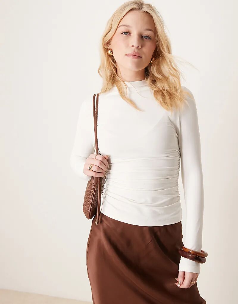 Топ из полиамида с высоким воротом и сборками по бокам кремового цвета ASOS DESIGN
Топ из полиамида с высоким воротом и сборками по бокам кремового цвета ASOS DESIGN