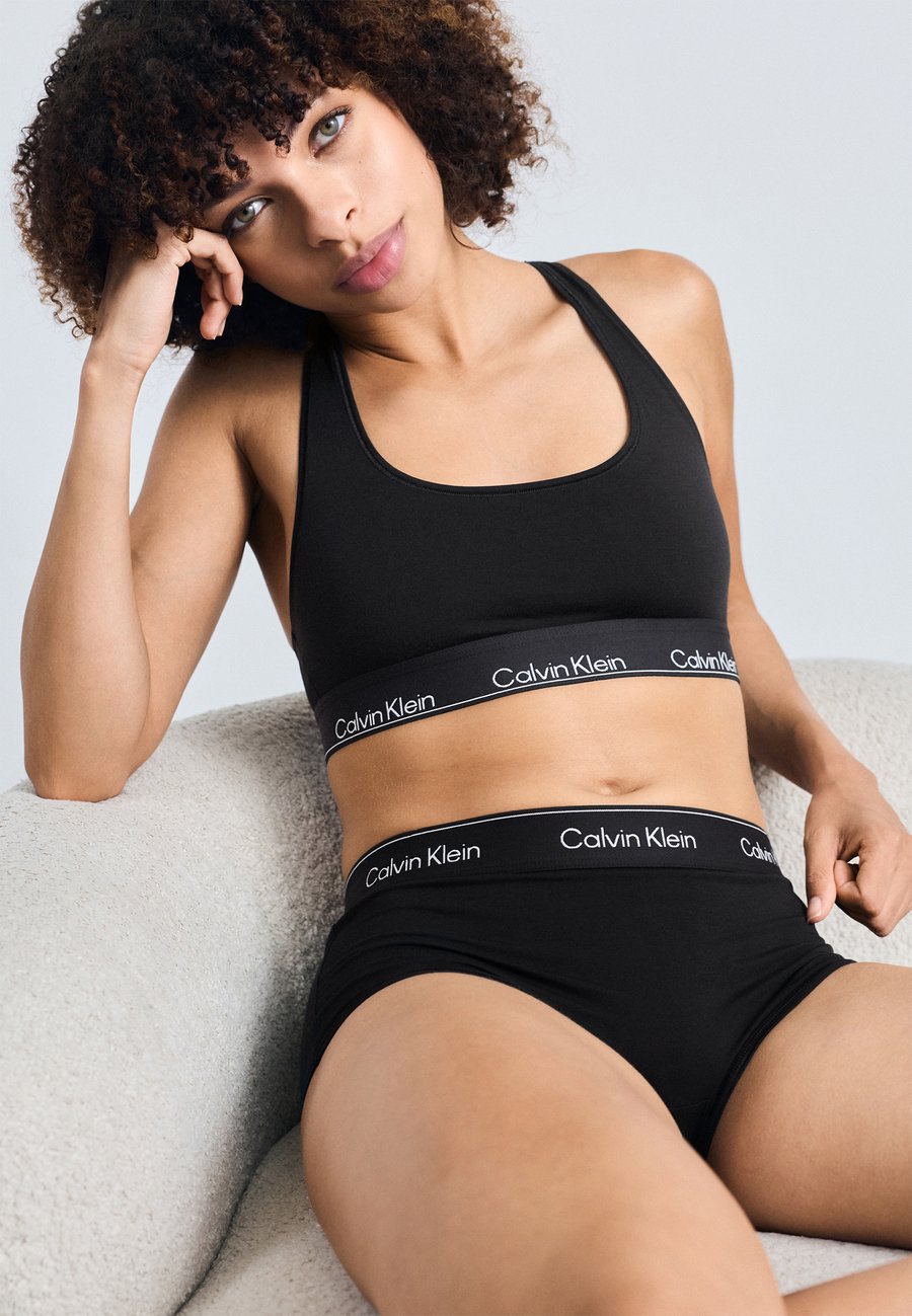 Бюстье Calvin Klein Underwear UNLINED BRALETTE ICON COTTON MODAL, Black
Бюстье Calvin Klein Underwear UNLINED BRALETTE ICON COTTON MODAL, Black