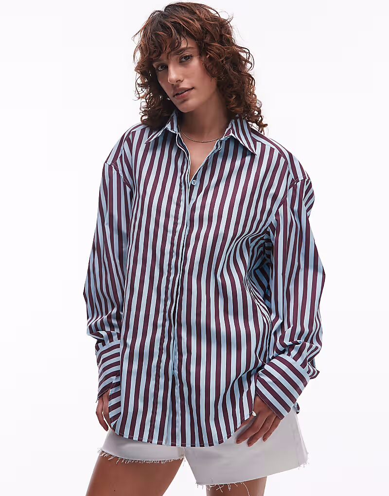 Рубашка Topshop из поплина очень большого размера в длинную полоску бледно-голубого и бордового цвета
Рубашка Topshop из поплина очень большого размера в длинную полоску бледно-голубого и бордового цвета