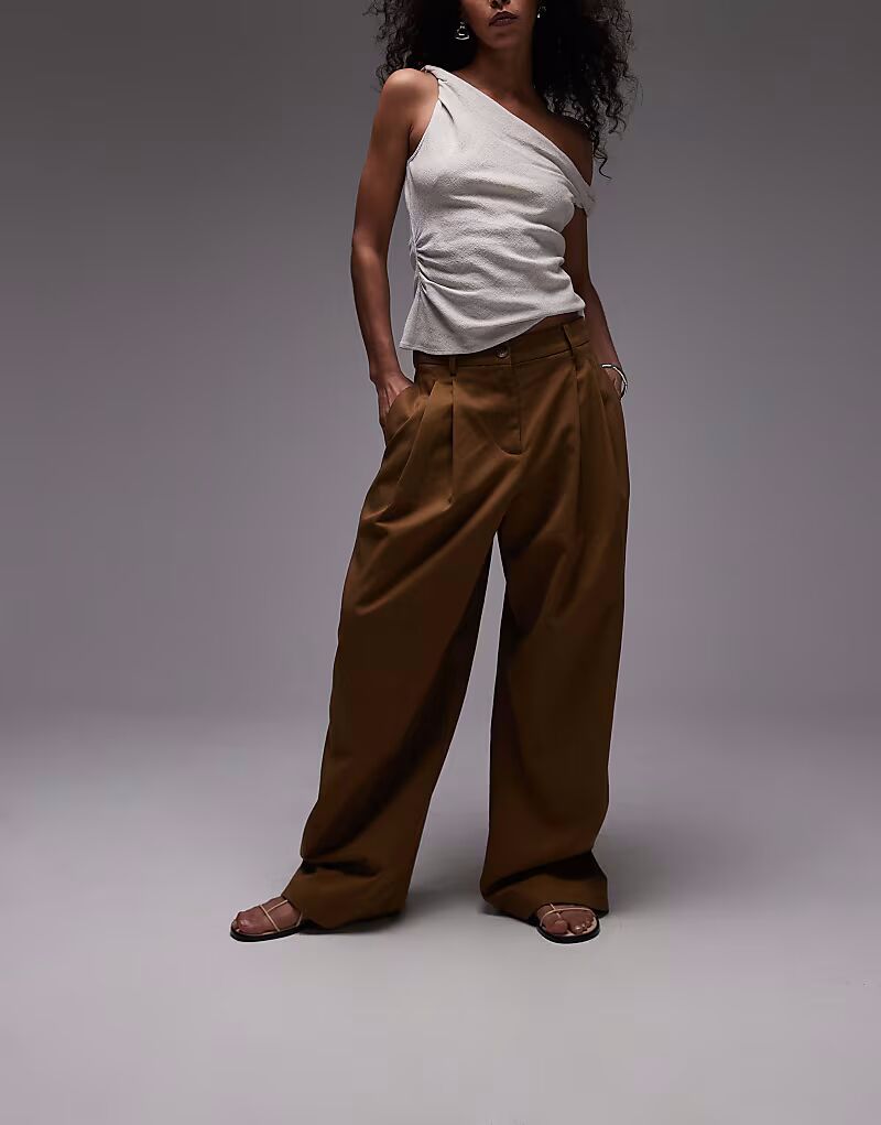 Брюки-баллоны Mango со складками спереди зеленого цвета
Брюки-баллоны Mango со складками спереди зеленого цвета